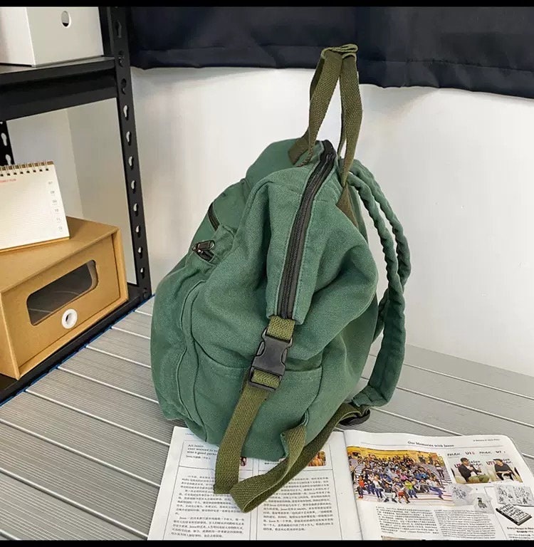 Stay Organized and On-the-Go with Our Multi-Pocket Canvas Backpack
