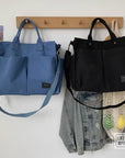 Durable canvas handbag with water-resistant lining and reinforced stitching