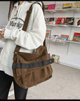 Versatile canvas crossbody bag with roomy main compartment and zippered pockets
