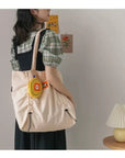 Bring Out Your Inner Boho-Chic with Our Fringe-Trimmed Canvas Shoulder Bag