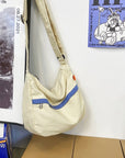 Durable canvas satchel with multiple pockets for organization