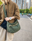 Stylish canvas messenger bag with adjustable shoulder strap and flap closure