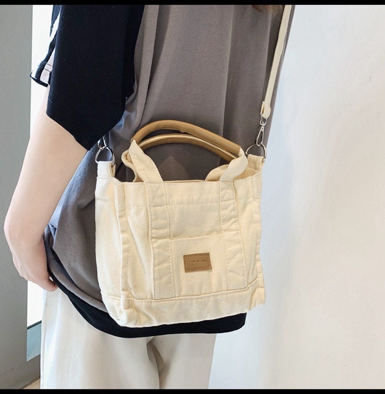 Stay Practical and Versatile with Our Convertible and Reversible Canvas Crossbody Bag