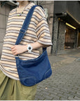 Find Your Perfect Match: Our Denim Crossbody Bag Comes in a Variety of Sizes and Styles