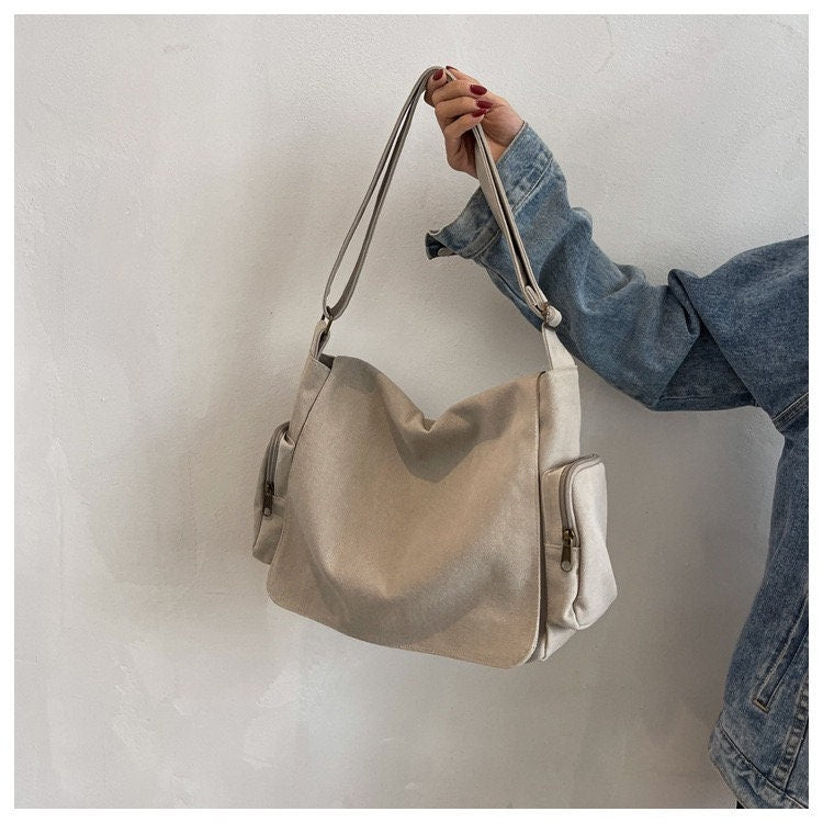 Stay Organized On-the-Go with Our Canvas Crossbody Bag