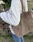 Carry Your World with Our Waxed Canvas Tote
